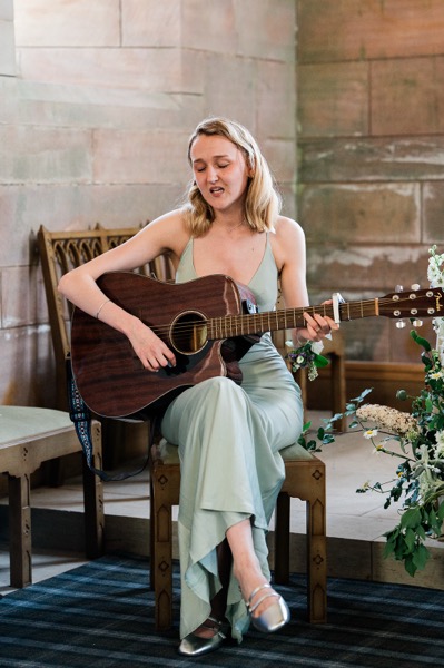 Molly Westbrook singing at a wedding.